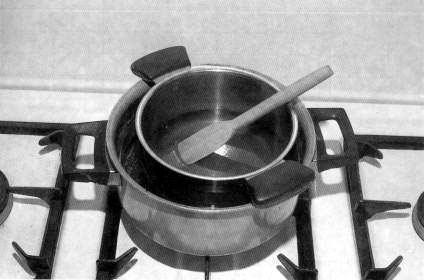 Small-scale heating of honey in a water bath.