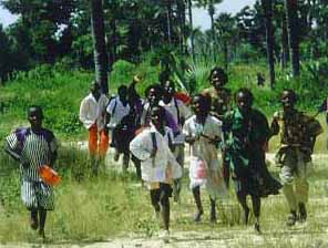 Boys running towards camera