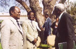 Discussions after the launch of project OSRO/RAF/404/SAF in Lusaka, Zambia, 4 August 2004. Left: William Amanfu, FAO-EMPRES, Rome; centre: Fred Musisi, Regional Project Coordinator, Johannesburg, South Africa; and right: Honourable M.F. Sikatana, Minister of Agriculture, Zambia