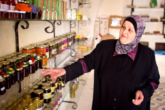Anaya Al Kayed displays some of the products produced by the various women’s cooperatives hosted by the Sebastiya Women’s Society at Qasr Al Kayed, in the West Bank village of Sebastiya. ©FAO/Marco Longari