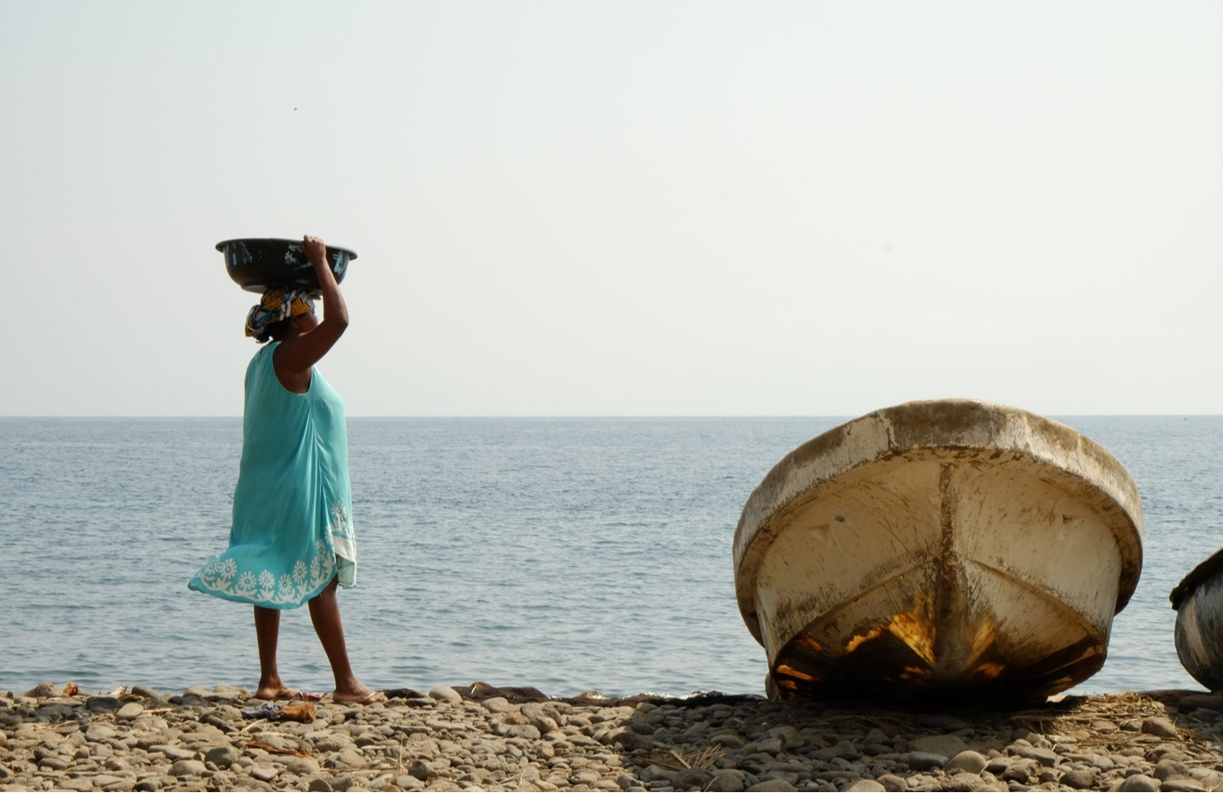 Woman near a fishing boat