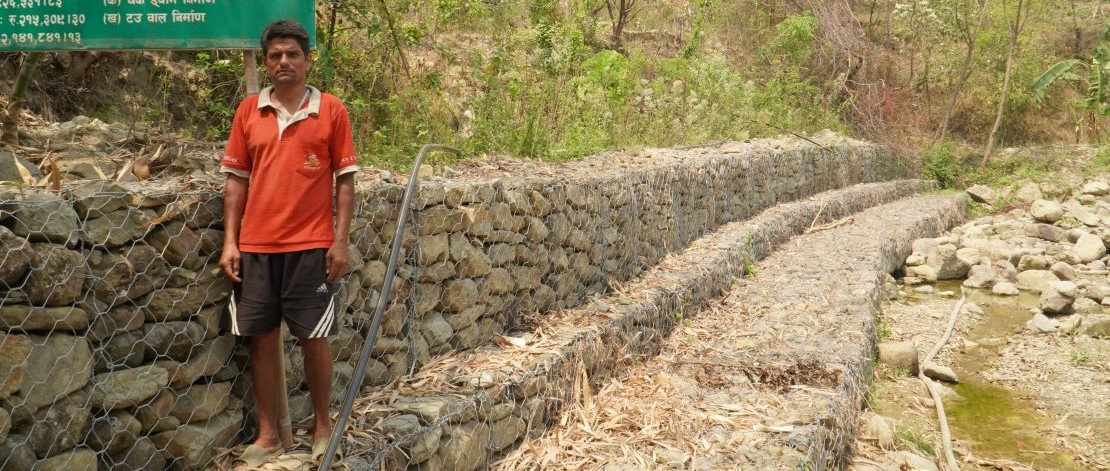 Rocks and stones create a protective barrier on the slopes of riverbanks